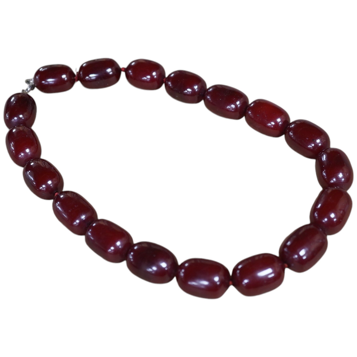 A single strand simulated cherry amber oval bead necklace, 48cm, gross weight 120 grams. Condition - fair